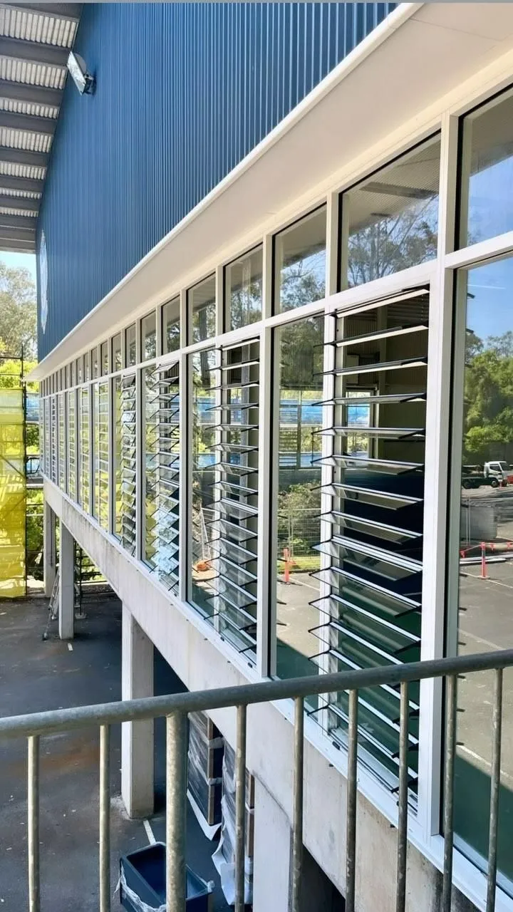 Sunshine Coast building clad in AGS aluminium windows and external shutters