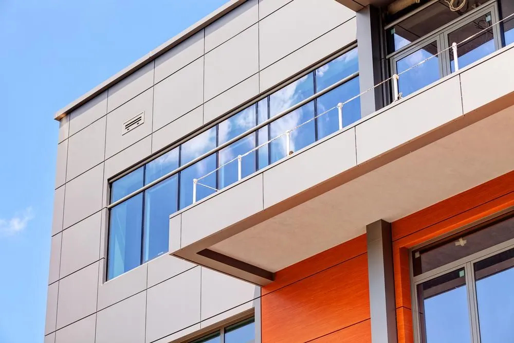 Large commercial building glazed with aluminium framing and balcony glazing